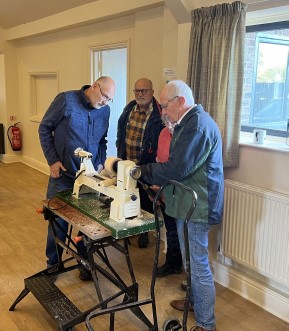 Howard guiding Janet on the <br>club lathe